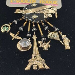 Moulin Rouge travel theme brooch.